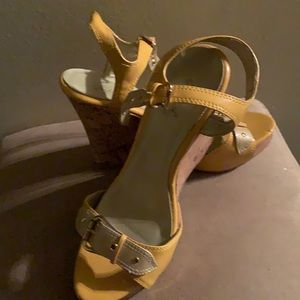 Super cute Qupid wedges.  Yellow in color.